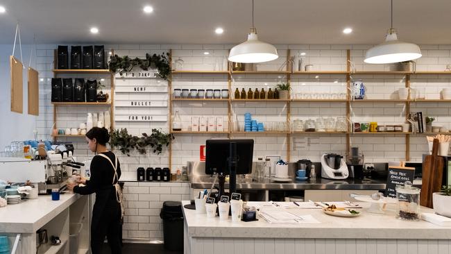 A barista at the Corner Table cafe in Mount Waverley makes a takeaway coffee. Picture: Asanka Ratnayake/Getty Images