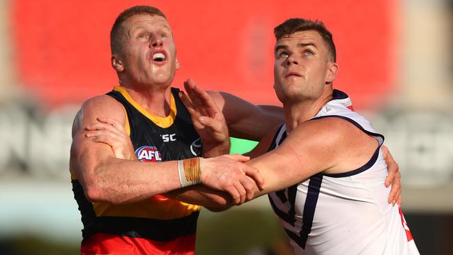 Reilly O'Brien grapples with Sean Darcy from the Dockers in last weekend’s game. Picture: Chris Hyde/Getty Images