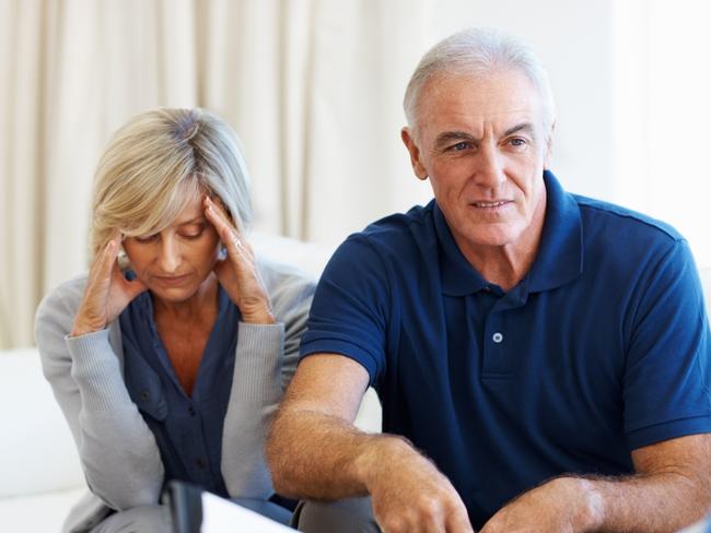 Senior couple clearing their doubts with the financial planner. financial advice, adviser, planner, stress, money generic