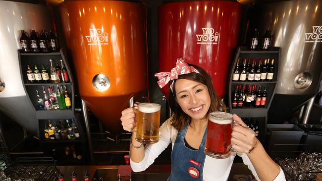 Harajuku Gyoza's Yoyogi Beer has joined the lineup for the events first year. Staff member Arisa Yamakawa toasts its success. Picture Glenn Hampson