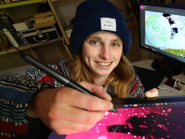 Not even recovering from a broken back and intermittently living out of a van could stop Geelong's Libby Clarke completing her masters this year. The RMIT graduate also gained international recognition for her practice in location-based gaming or playable cartoraphy.  picture: Glenn Ferguson