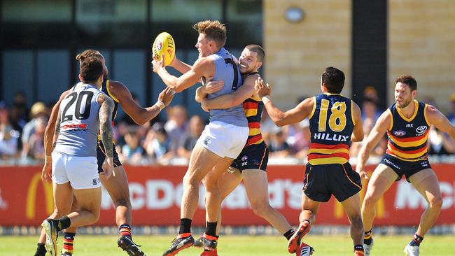 Bryce Gibbs tackles Brad Ebert in a JLT Community Series at Alberton. Picture: Daniel Kalisz/Getty Images