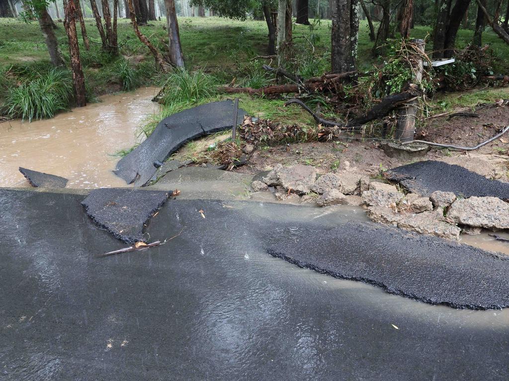 Road damaged by flood waters on Backwater Road, Greenbank. Picture: Liam Kidston