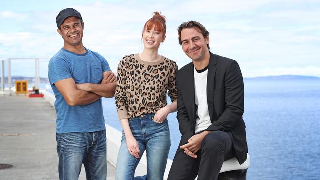 Aaron Pedersen, left, Emma Booth and Ewan Leslie at the announcement that streaming service Stan will broadcast The Gloaming, which will be shot entirely in Tasmania. Picture: LUKE BOWDEN