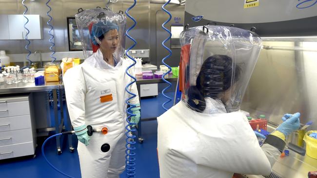 Virologist Shi Zheng-li (left) with a colleague in the P4 lab of Wuhan Institute of Virology on February 23, 2017. Picture: Getty