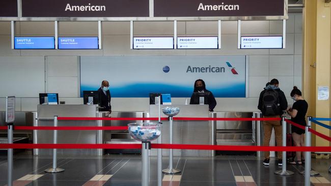 An almost empty American Airlines chck in at Ronald Reagan Washington National Airport. Picture: AFP