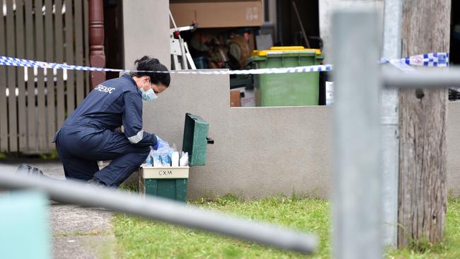 Forensic investigators scour the scene. Picture: Nicki Connolly