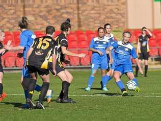 ON TARGET: Chloe Hutton scores for the South West Queensland Thunder in the NPLWQ game against Mudgeeraba last season. Hutton featured in the Thunder's senior squad after an excellent run of form in the juniors. Picture: Kevin Farmer