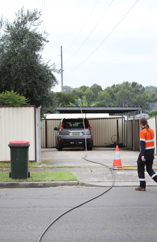 A downed power line over the car port of resident Russ Gazitepe. Picture: Richard Dobson