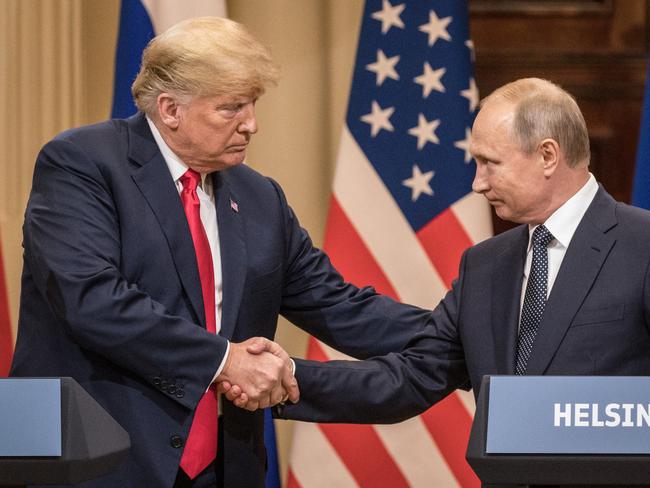 HELSINKI, FINLAND - JULY 16: U.S. President Donald Trump (L) and Russian President Vladimir Putin shake hands during a joint press conference after their summit on July 16, 2018 in Helsinki, Finland. The two leaders met one-on-one and discussed a range of issues including the 2016 U.S Election collusion.  (Photo by Chris McGrath/Getty Images)