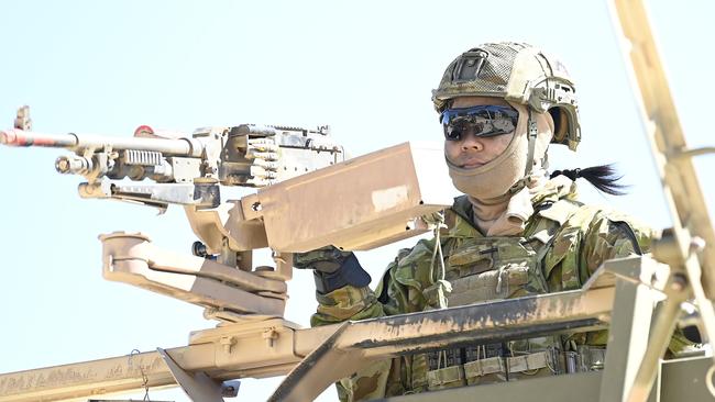 An Australian soldier from 3 Combat Service Support Battalion (CSSB) keeps watch during a resupply mission as part of Exercise Talisman Sabre 2023 in Townsville. Picture: Ian Hitchcock/Getty Images