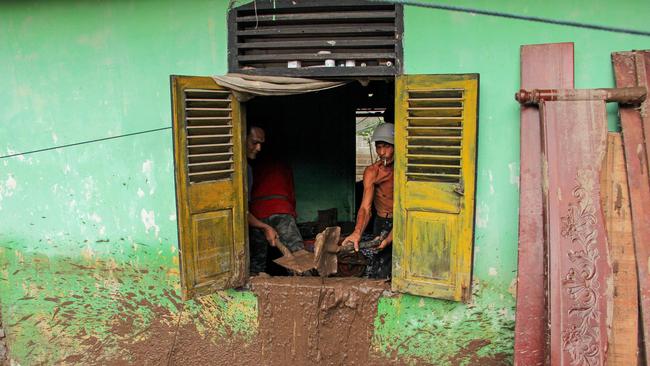 Villagers clean up at Pesisir Selatan at the weekend. Picture: AFP
