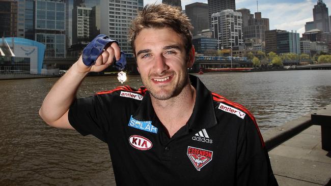 Jobe Watson with his Brownlow Medal won in 2012 which he on Friday handed back.