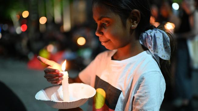 A young girl takes part in a candlelight vigil for Cassius Turvey. Picture: Dan Peled/Getty Images