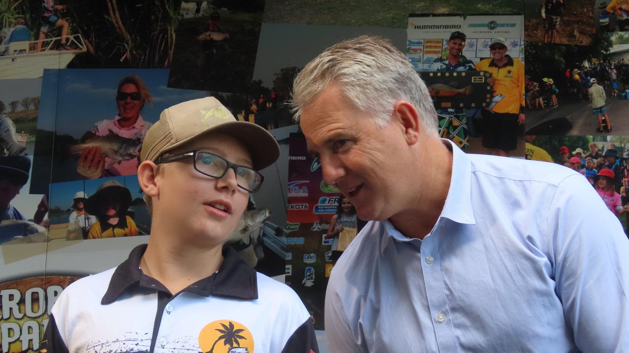 Young fisho Ryan 'Buddy' Higgs and Recreational Fishing Minister Joel Bowden had a good yarn about the Barras they hoped to catch this dry season. Picture: Harry Brill.