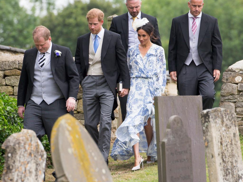 Meghan and Harry loved up at society wedding: Pictures | news.com.au ...
