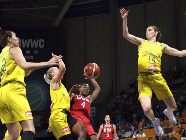 Jewell Loyd of the United States, second right, and Alanna Smith of Australia, second left, fight for the ball. Picture: AP Photo