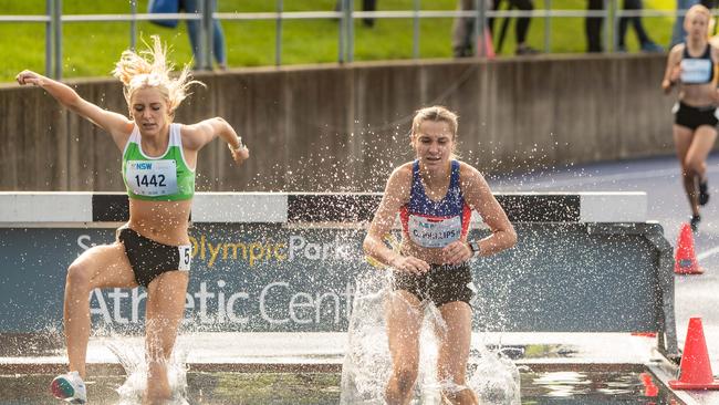 Steeplechase water jump action for Georgia Phillips from Eastwood (right).