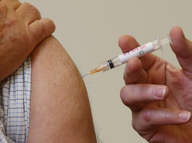 The Federal Government has recommended that people under the age of 50 not receive the AstraZeneca COVID-19 coronavirus vaccine, due to the extremely small chance of the patient developing blood clots. Geoff Isaacs receives a dose of the AstraZeneca COVID-19 vaccine from general practitioner Dr. Anthony Kresevic at the Edmonton Family Medical Centre. Picture: Brendan Radke