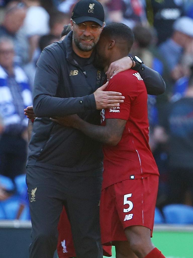 Liverpool manager Jurgen Klopp embraces his first goal scorer. 