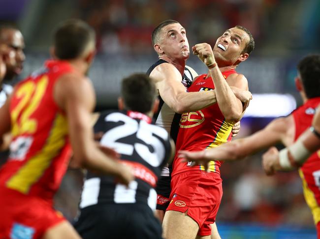 Darcy Cameron goes head-to-head with Gold Coast’s Jarrod Witts last week. Picture: Chris Hyde/Getty Images