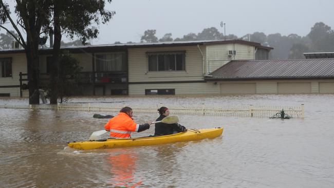 Vineyard residents use a canoe to access their property. Picture: John Grainger