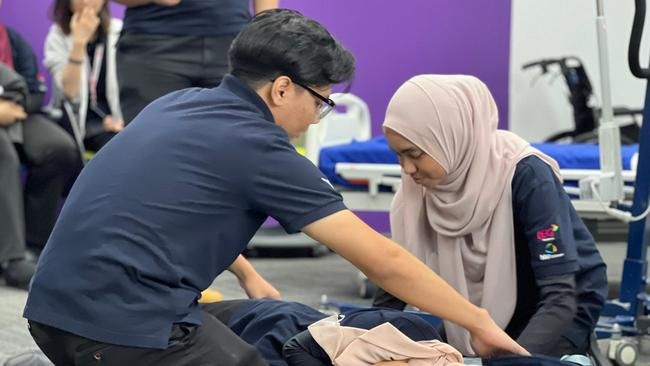 Students Hazman Hakimi Bin Mohamed Zafrualam and Puteri Zulnur Haslyzwannie take part in practical training at NV College.