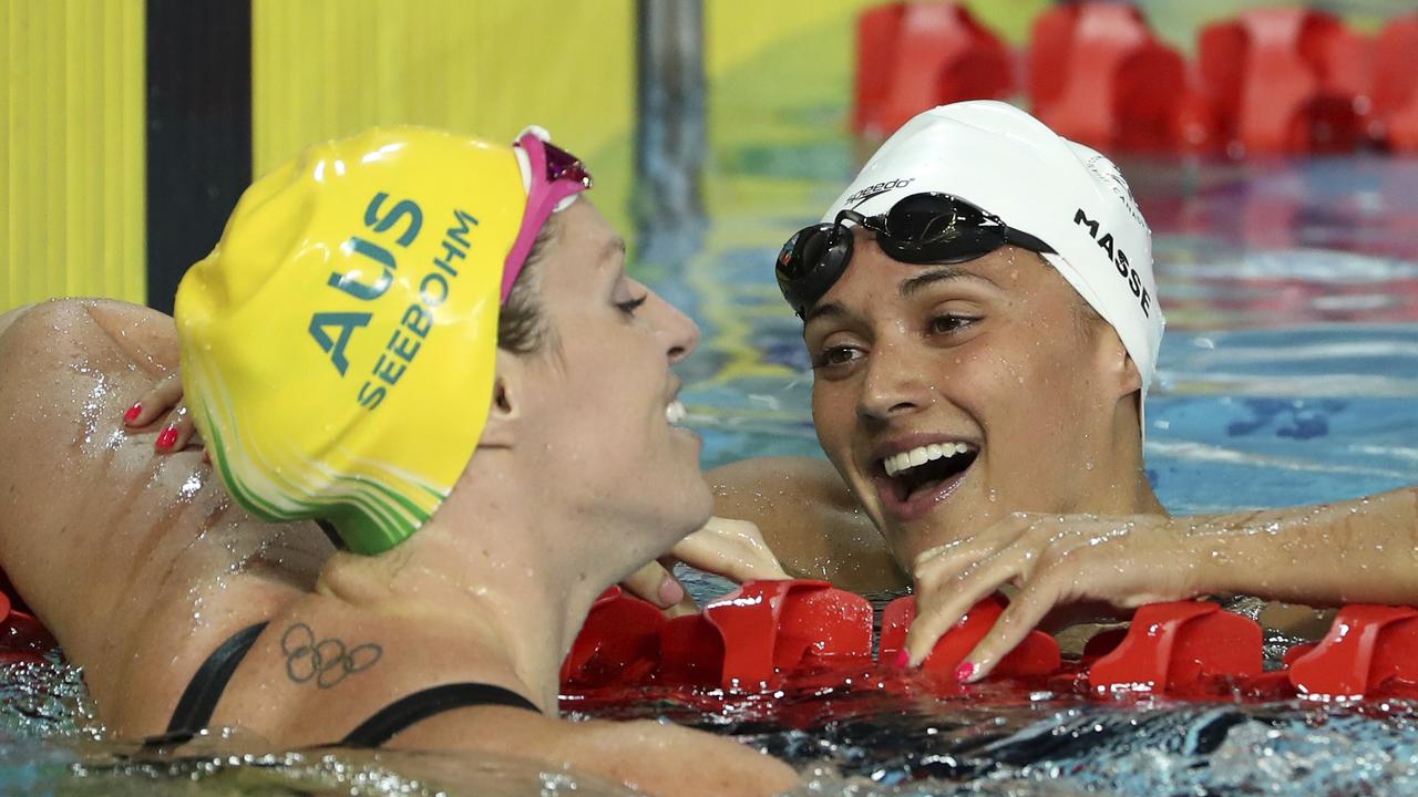 Canada's Kylie Masse, right, with Emily Seebohm after an epic battle in the 100m backstroke final.