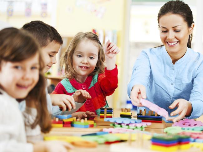 Generic photo of a childcare worker and children in a daycare centre