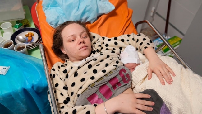 Mariana Vishegirskaya lies in a hospital bed after giving birth to her daughter Veronika. Picture: AP /Evgeniy Maloletka