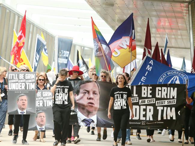 Union protestors from the Queensland Council of Unions (QCU) march through the Brisbane CBD in Brisbane, Wednesday, November 22, 2017. (AAP Image/Jono Searle) NO ARCHIVING