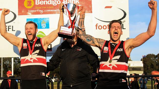 Park Orchards captain Tom Feher and coach Jarrod Bayliss (right) lift the EFL Division 3 cup in 2017. Picture: Davis Harrigan