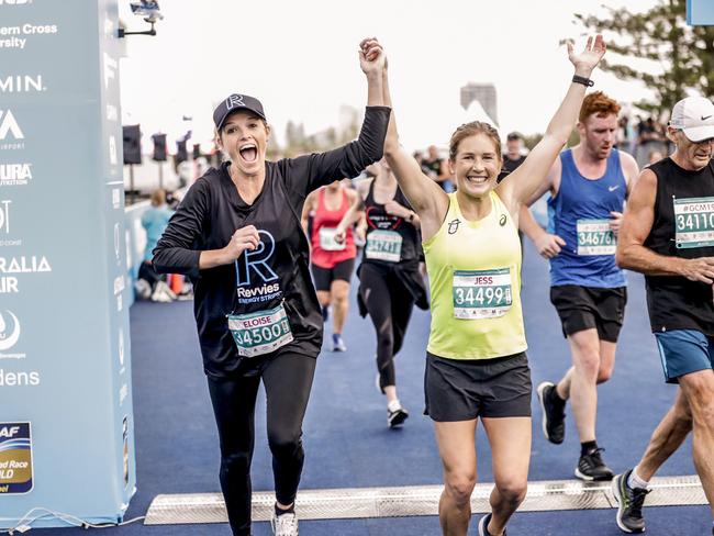 Elouise Wellings and Jessica Stenson are delighted to cross the finish line of the Southern Cross University ten kilometre Fun Run. Pic Tim Marsden