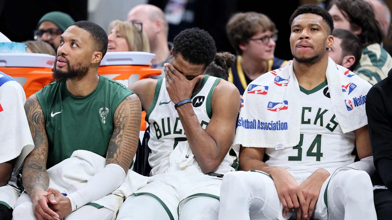 Damian Lillard #0, Malik Beasley #5 and Giannis Antetokounmpo #34 of the Milwaukee Bucks sit on the bench in the final minute of the 142-130 loss to the Indiana Pacers at Gainbridge Fieldhouse on January 03, 2024 in Indianapolis, Indiana. (Photo by ANDY LYONS / GETTY IMAGES NORTH AMERICA / Getty Images via AFP)