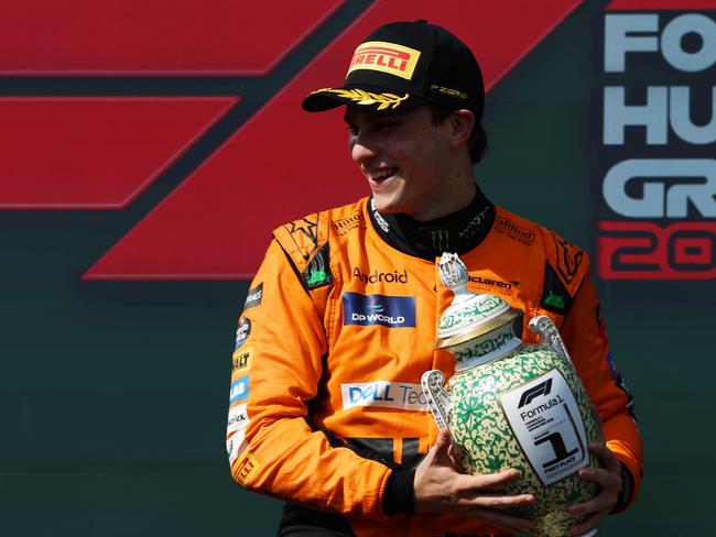 BUDAPEST, HUNGARY - JULY 21: Race winner Oscar Piastri of Australia and McLaren celebrates his maiden race win on the podium during the F1 Grand Prix of Hungary at Hungaroring on July 21, 2024 in Budapest, Hungary. (Photo by Dean Mouhtaropoulos/Getty Images)