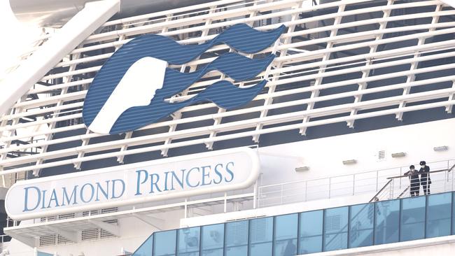 Passengers wearing face masks aboard the Diamond Princess cruise ship. Picture: Behrouz Mehri/AFP)