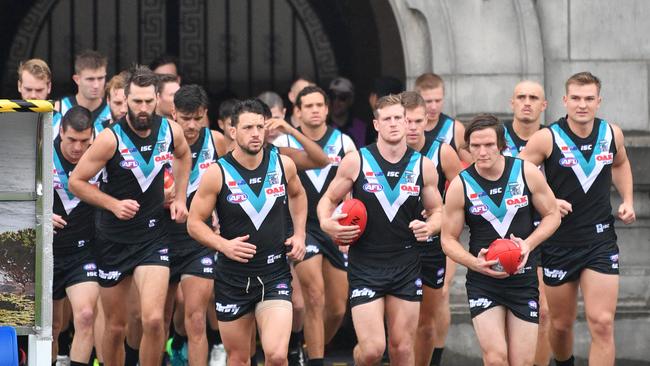 Power players run onto the field for the Shanghai Cup clash. Picture: AAP Image/David Mariuz