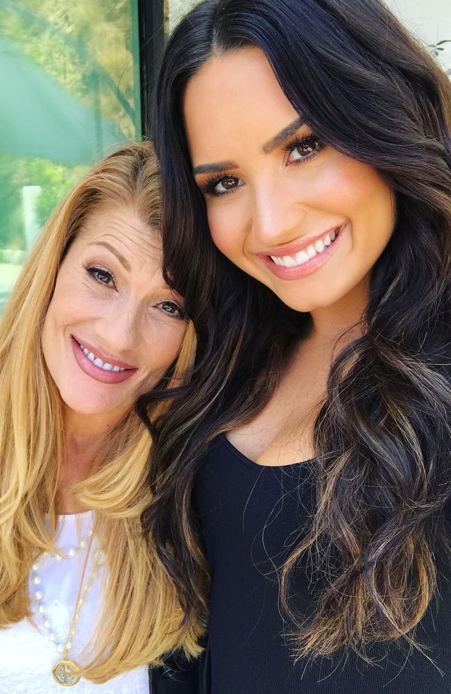 Demi (right) with her mum Dianna, a former Dallas Cowboys cheerleader.