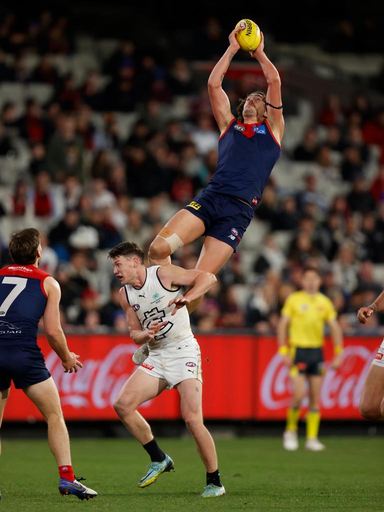 Luke Jackson takes a spectacular mark over Sam Walsh. Picture: Michael Willson/AFL Photos