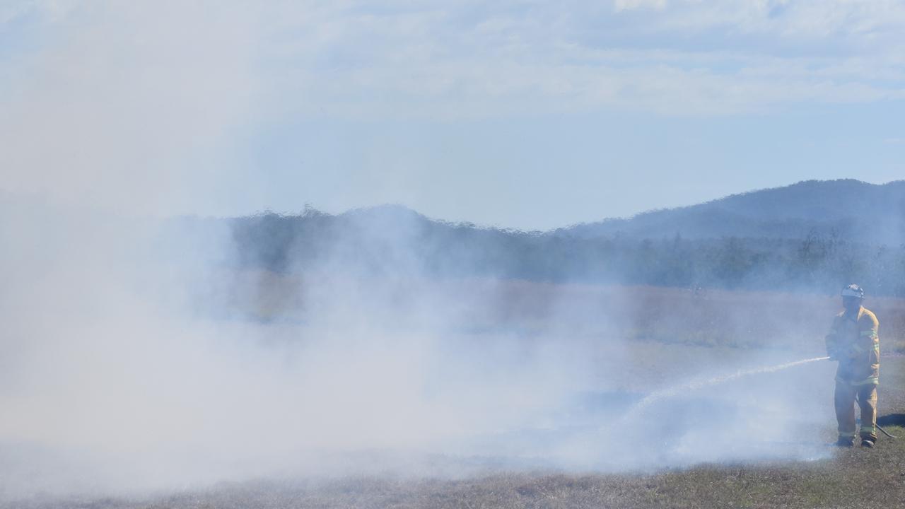 Putting out a grass fire caused by the missile launch.