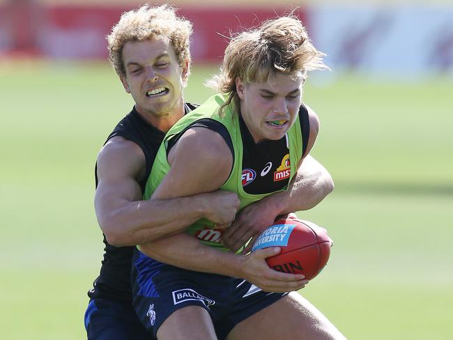 Dogs’ draftee Bailey Smith has shown he can withstand the heat of senior footy, going head to head with the likes of hard nut Mitch Wallis. Picture: Michael Klein