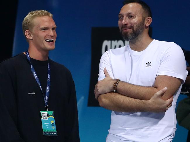 Cody Simpson and Ian Thorpe talk during the 2021 Australian Swimming Championships at the Gold Coast Aquatic Centre. Picture: Getty