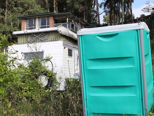 A man has left a caravan and a "porta-loo" in the front yard of his land at 24 Roselands Ave Wyoming on the Central Coast. Apparently the man has gone back to India and council haven't removed the eyesore. Picture: David Swift