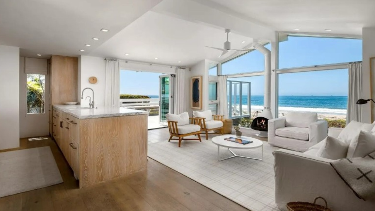 A view of the kitchen and living room looking out on the ocean. Picture: Realtor/Berkshire Hathaway