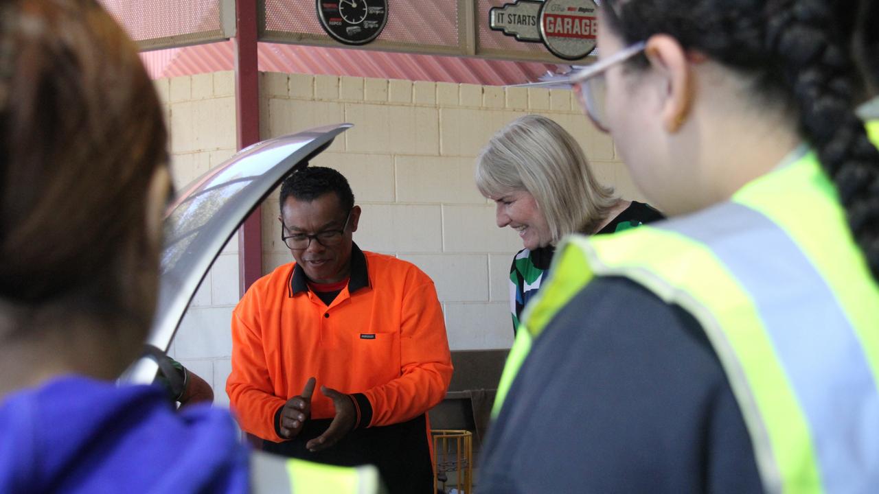 Northern Territory Chief Minister Eva Lawler talks cars in Alice Springs with a tutor from Centralian Senior College's Vroom program. Picture: Gera Kazakov