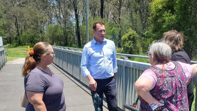 Councillor Steve Griffiths meets residents at Stable Swamp Creek in 2022 to discuss its clean-up.