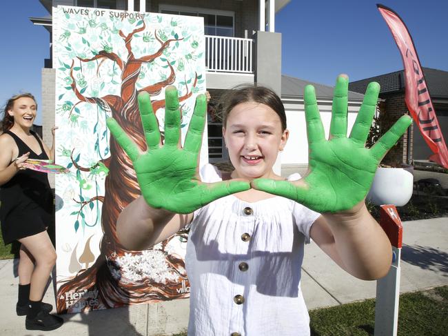 The GFA Charity Home is now finished.Nine year old Ava Pattie who has celebrated two years clear of leukaemia and was a patient of the Royal ChildrenÃs Hospital paints her hand prints with RCH patients hand prints on the mural by artist Justine Millsom aka Juzpop Creations. Picture: David Caird