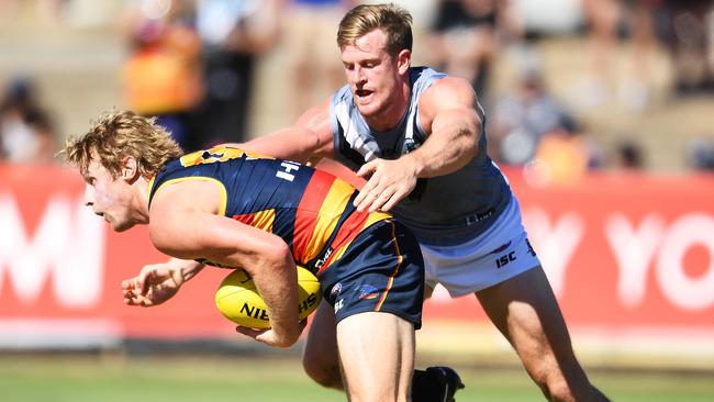 Power co-captain Tom Jonas catches Crows co-captain Rory Sloane during last year’s AFL JLT Community Series match. Picture: AAP Image/Mark Brake