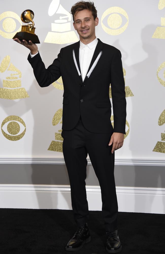 Australian Grammy-winner Flume suited up in a jacket with white detailing on the lapels, to collect his Grammy for best dance/electronic album (Skin). Picture: AP