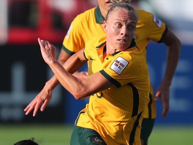 MUMBAI, INDIA - JANUARY 21: Tameka Yallop of Australia goes past Rani Multa Sari of Indonesia during the AFC Women's Asian Cup Group B match between Australia and Indonesia at Mumbai Football Arena on January 21, 2022 in Mumbai, India. (Photo by Thananuwat Srirasant/Getty Images)